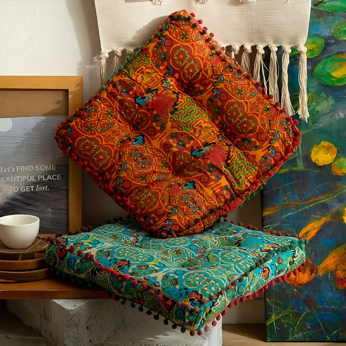 Blue and orange square cushions with pom-pom trim