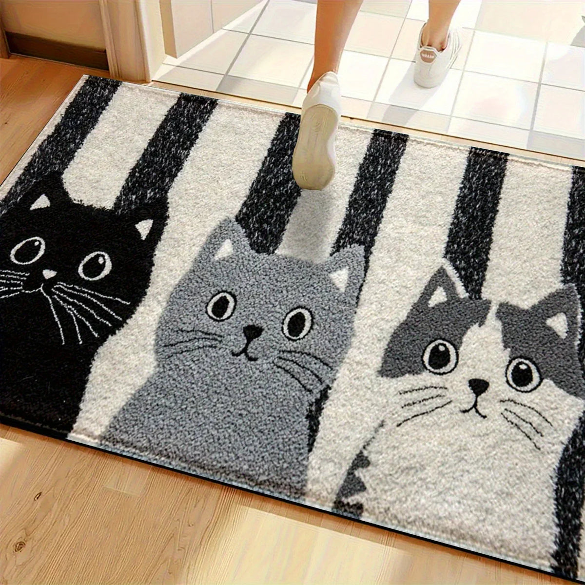 Cat mat beneath shoes at an entrance
