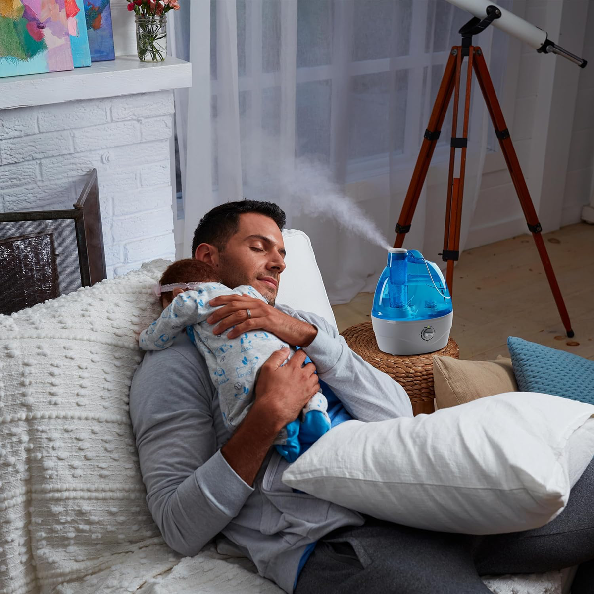 Cool mist humidifier shown beside seating