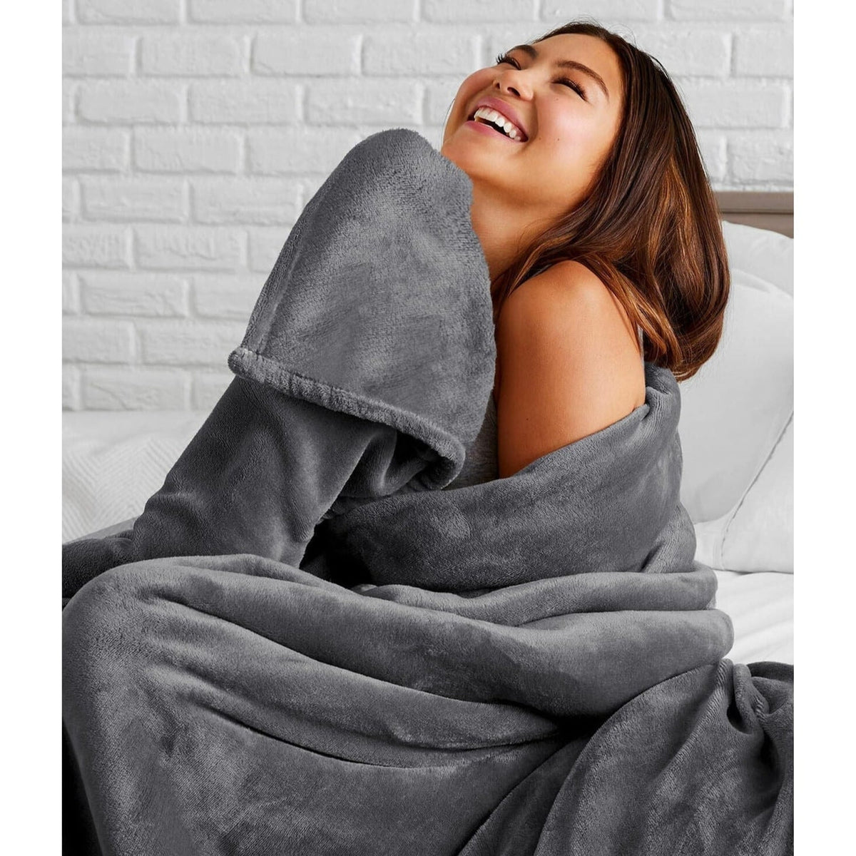 Grey fleece blanket wrapped around the shoulders