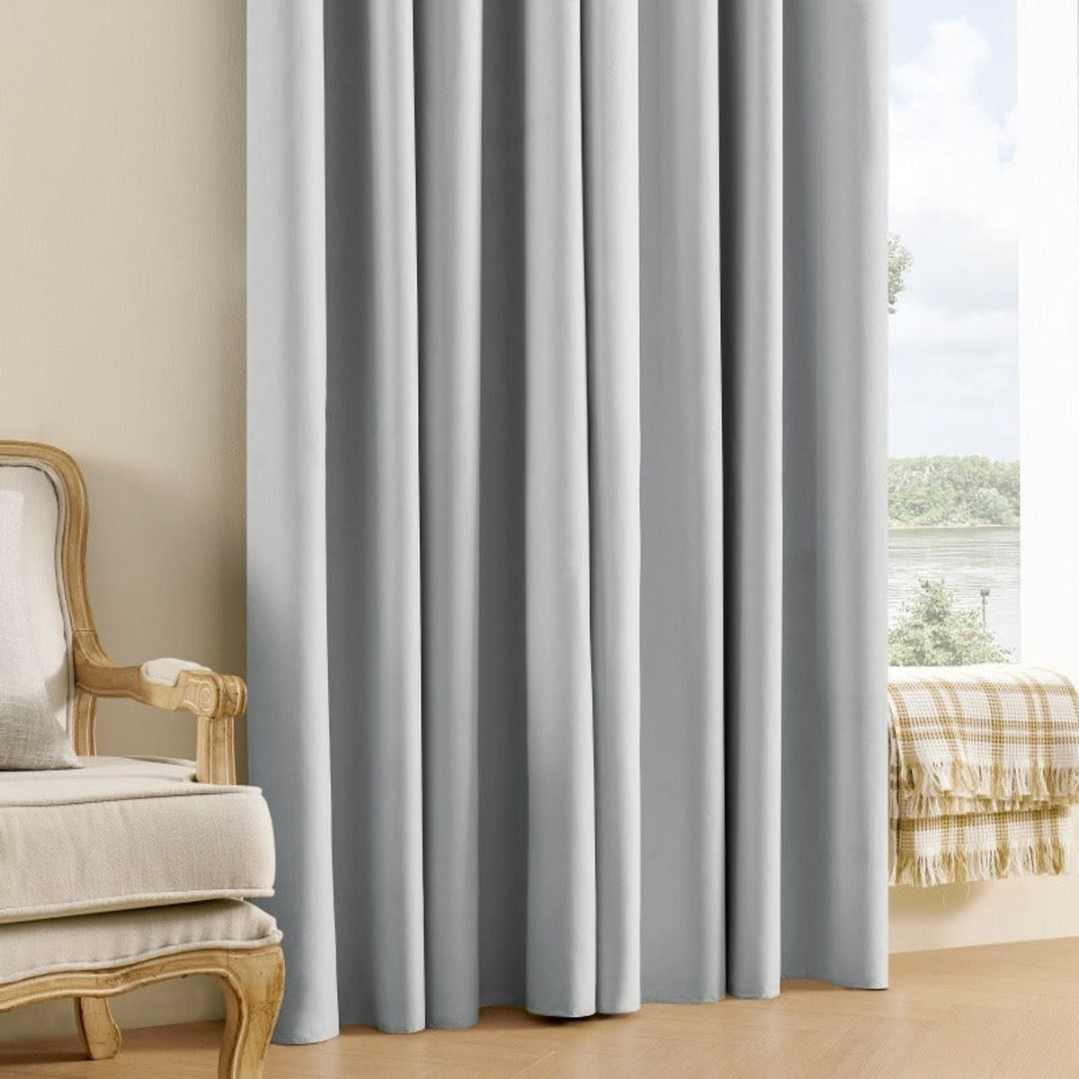 Grey blackout curtain drawn across a window
