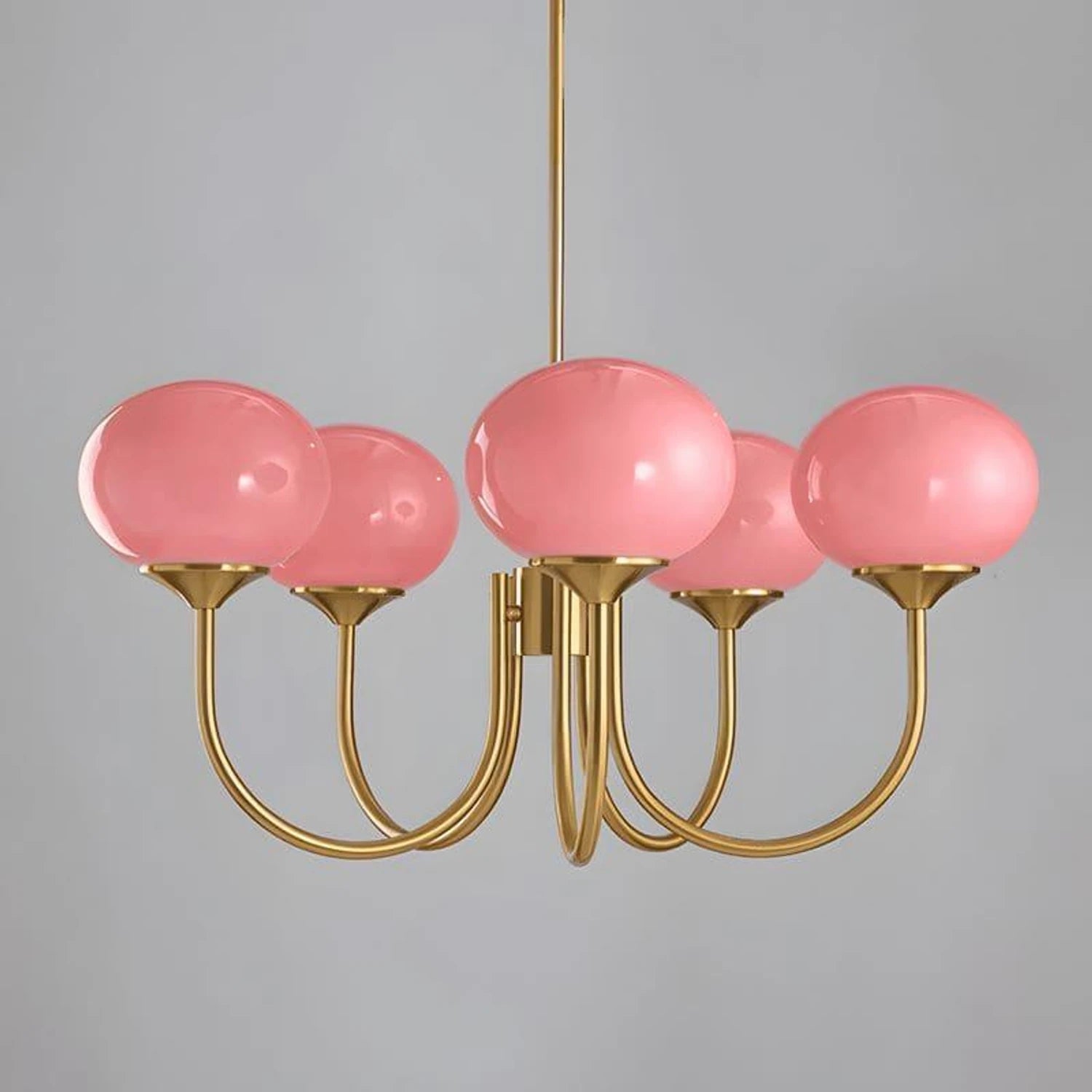 Modern glass ball pendant light with metal finish, suitable for living room or bedroom ceiling lighting.
