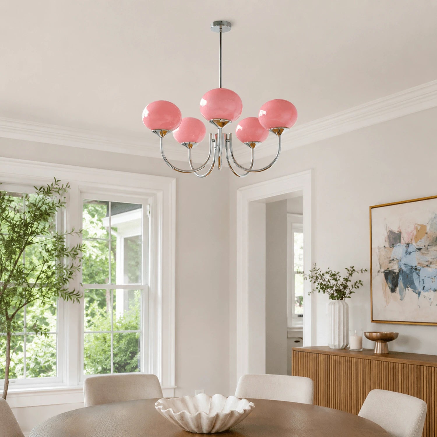 Modern glass ball pendant light with metal finish, suitable for living rooms and bedrooms, available in 3 or 5 light configurations.