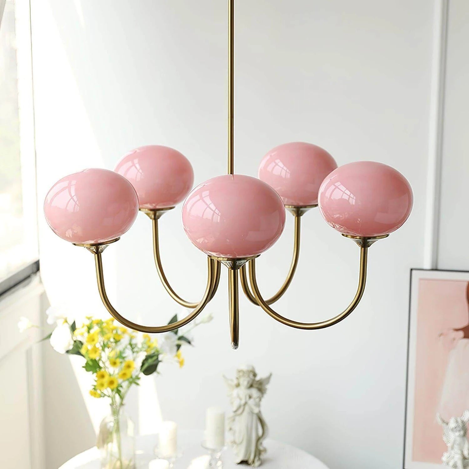 Modern glass ball pendant light with metal finish, suitable for living room or bedroom ceiling lighting.