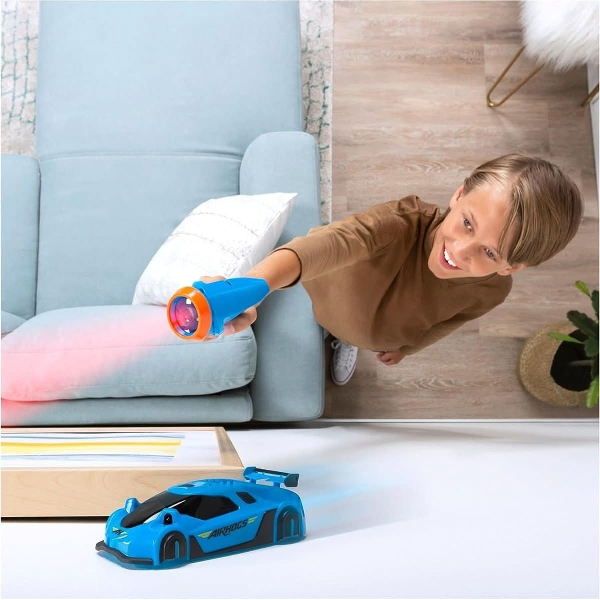 Blue wall-climbing car with handheld light controller