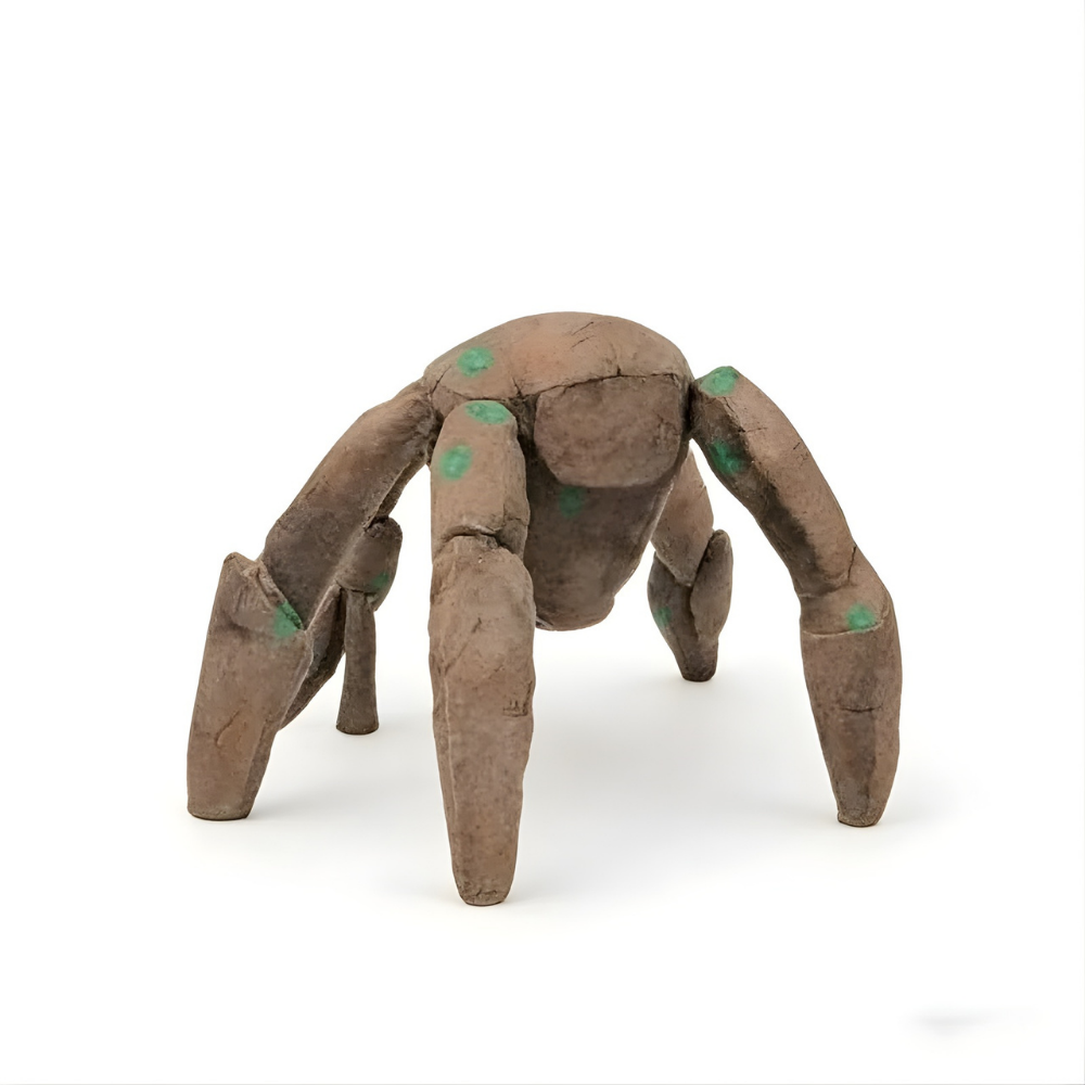 Front view of soft brown multi-limbed character