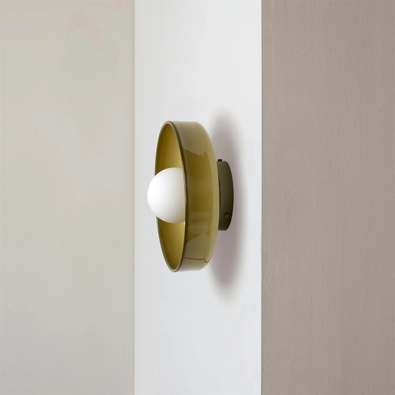 Minimalist modern flush mount ceiling light in olive green with a low-profile design for soft, diffused home lighting.