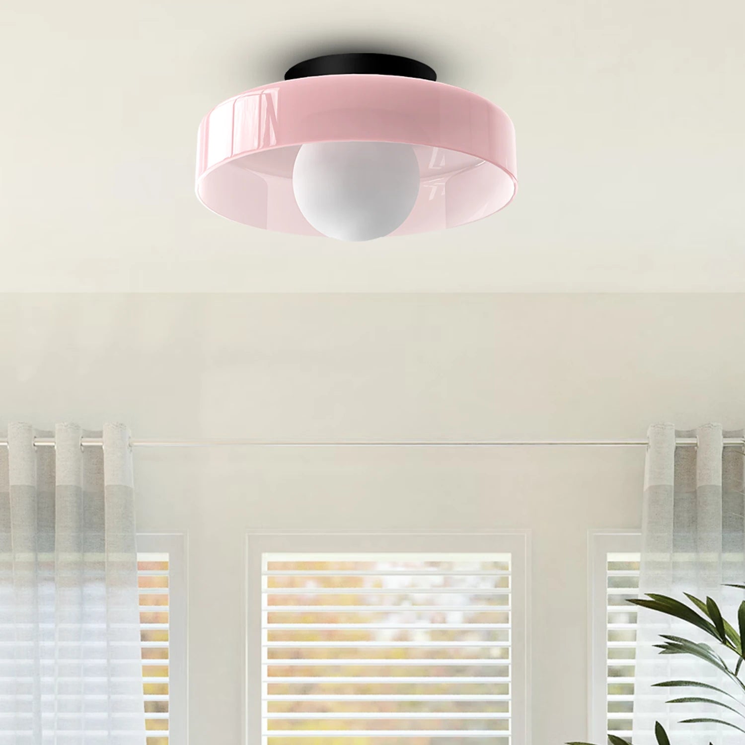 Minimalist modern flush mount ceiling light in a low-profile design for soft, glare-free illumination in bedrooms and hallways.