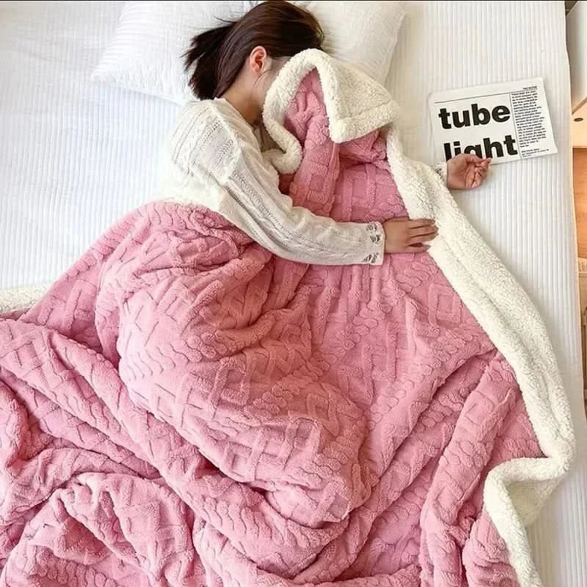 Pink floral-textured blanket with light reverse