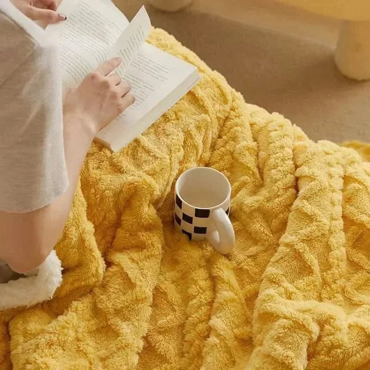 Yellow blanket showing raised floral texture