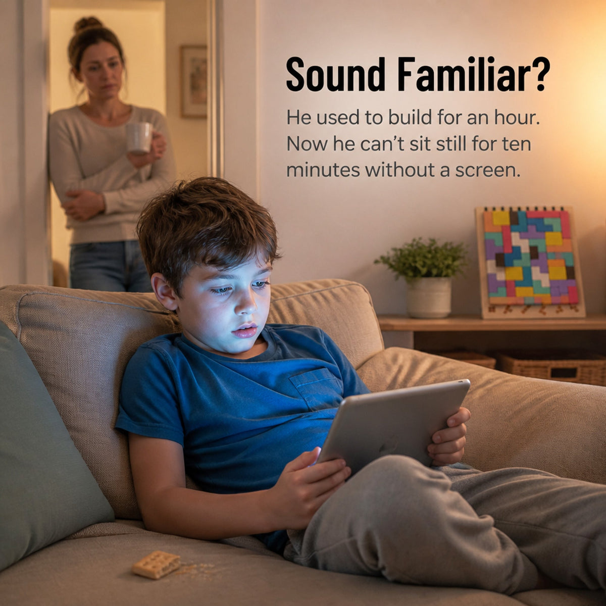 Upright slatted puzzle beside a child using a tablet