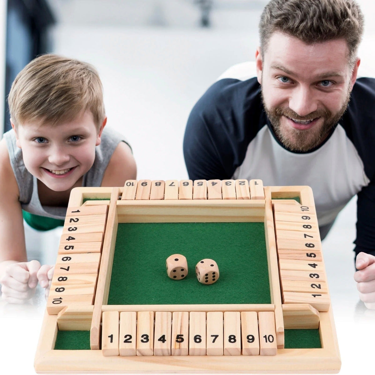 Family playing a four-sided wooden number board game