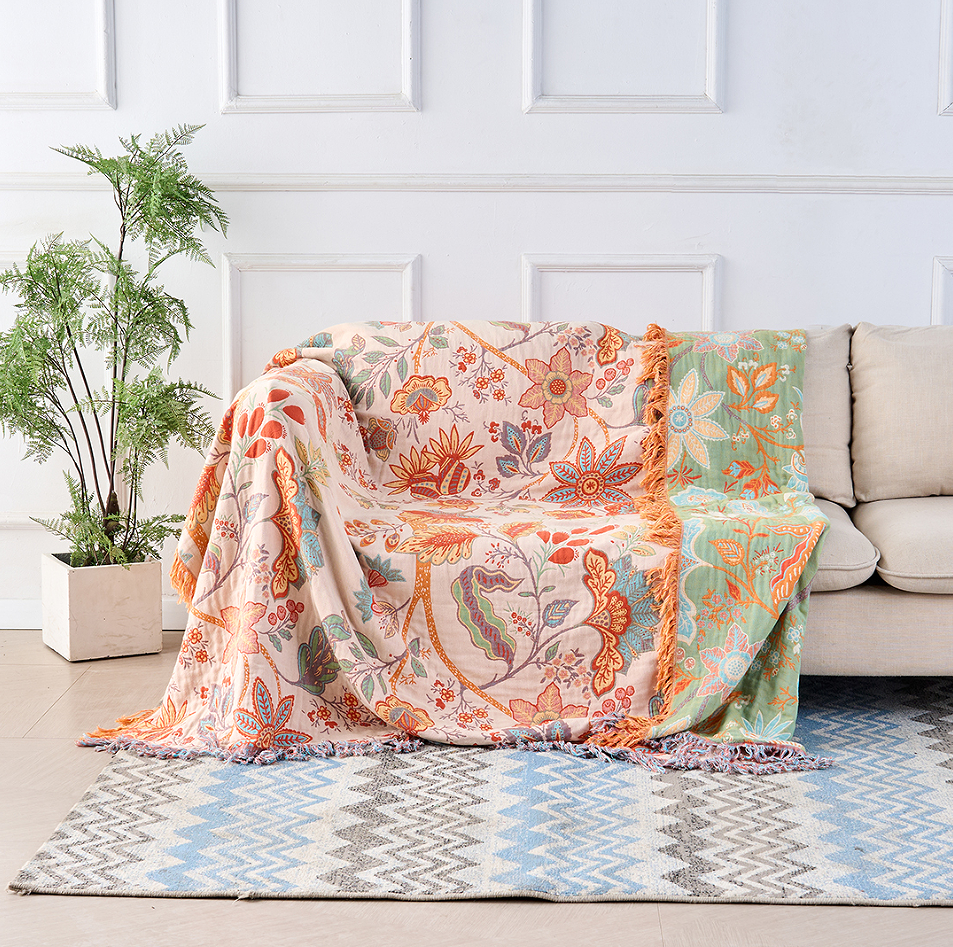 Floral cotton throw draped over a sofa