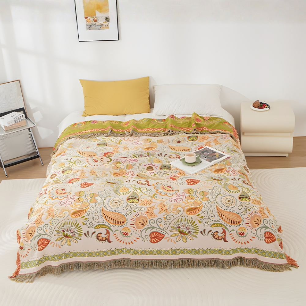 Sunny Fern folk art cotton throw across a bed