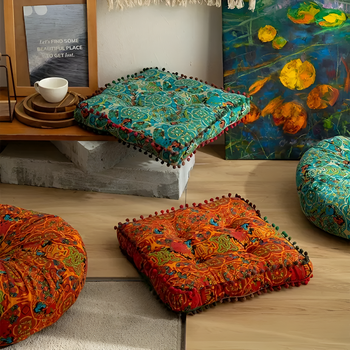 Geometric floor cushions arranged beside a sofa