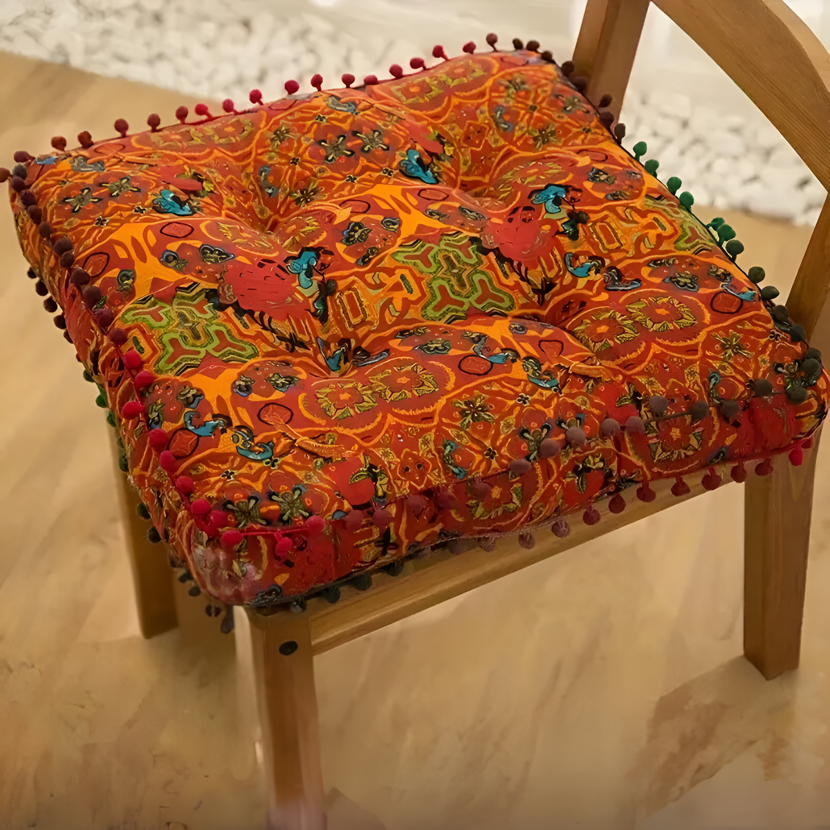 Orange square geometric cushion on a chair