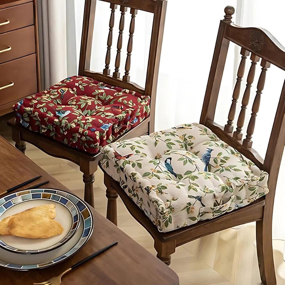 Floral tufted cushions on chairs in red and beige