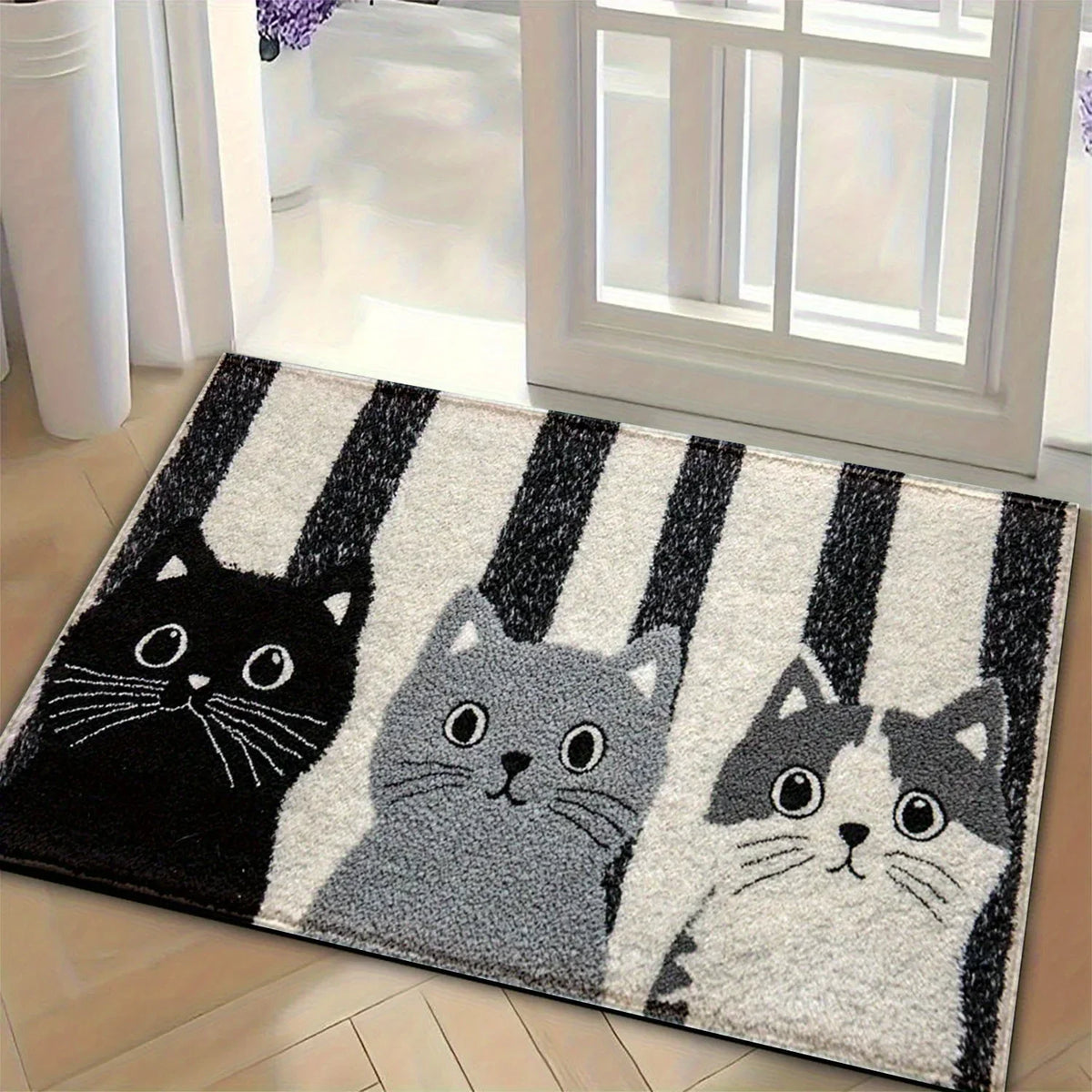 Cat-patterned mat beside a window