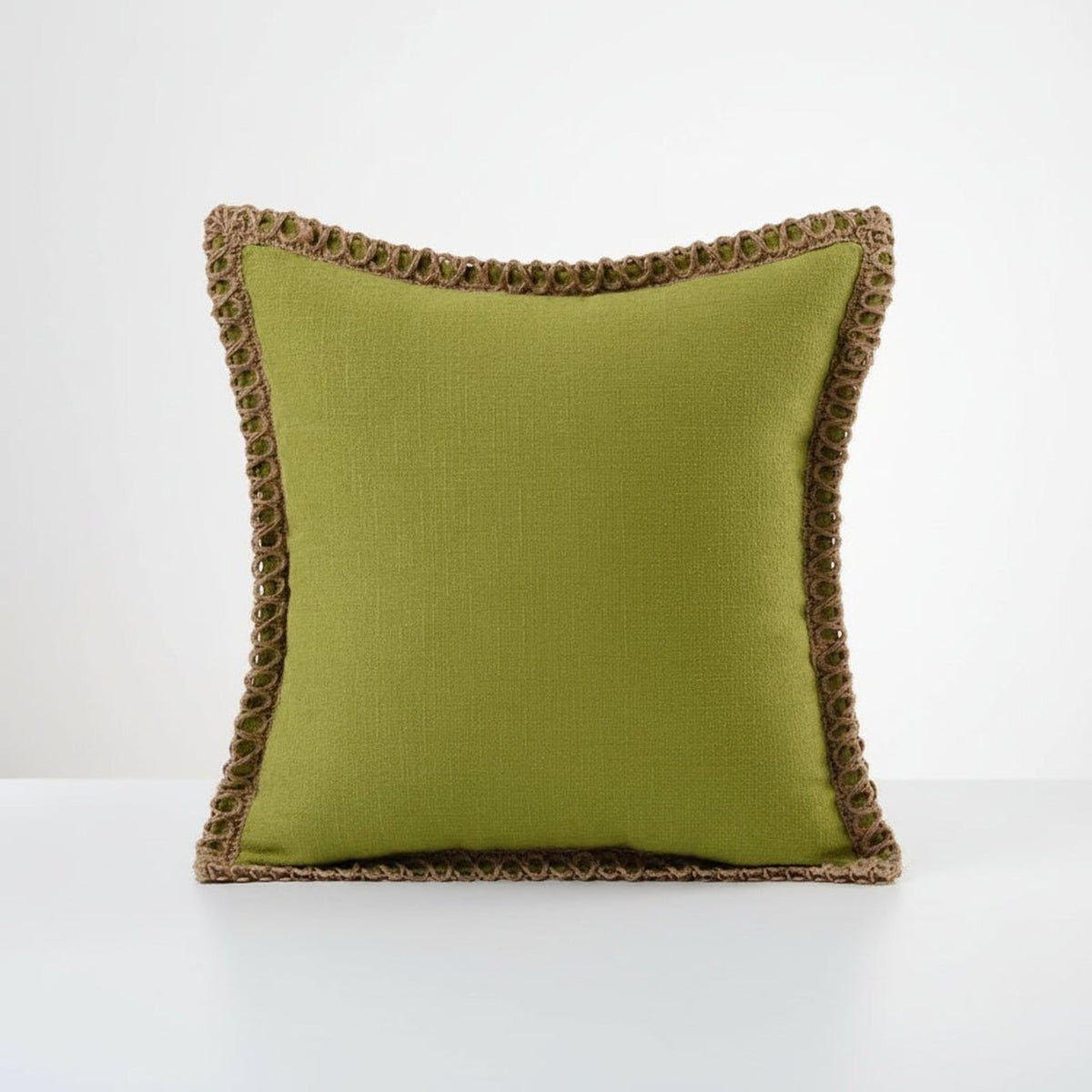 Olive green square cushions with crocheted edging