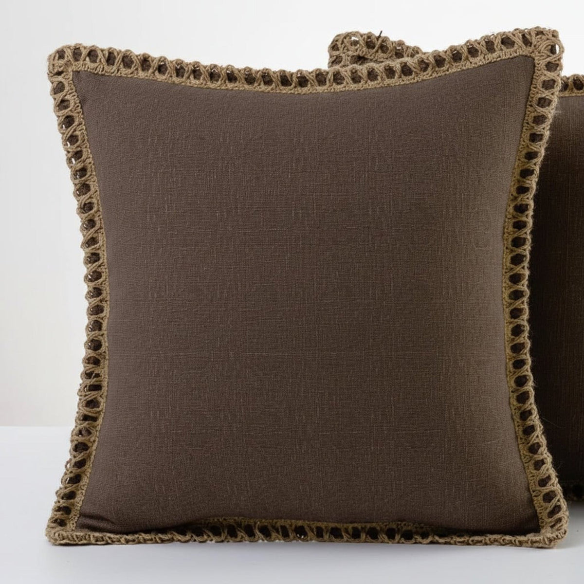 Chocolate brown cushions with crochet trim