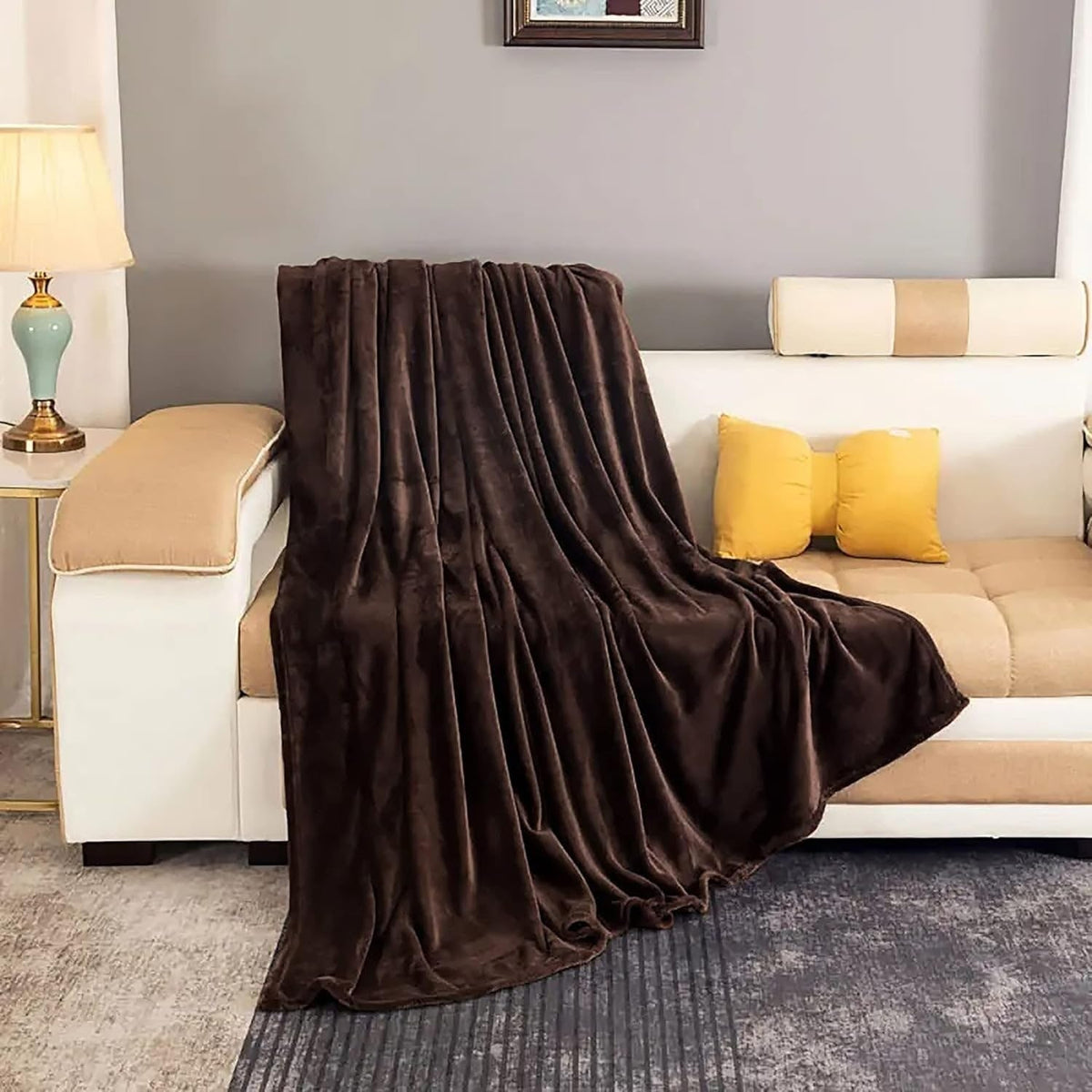 Coffee brown fleece throw draped over a sofa