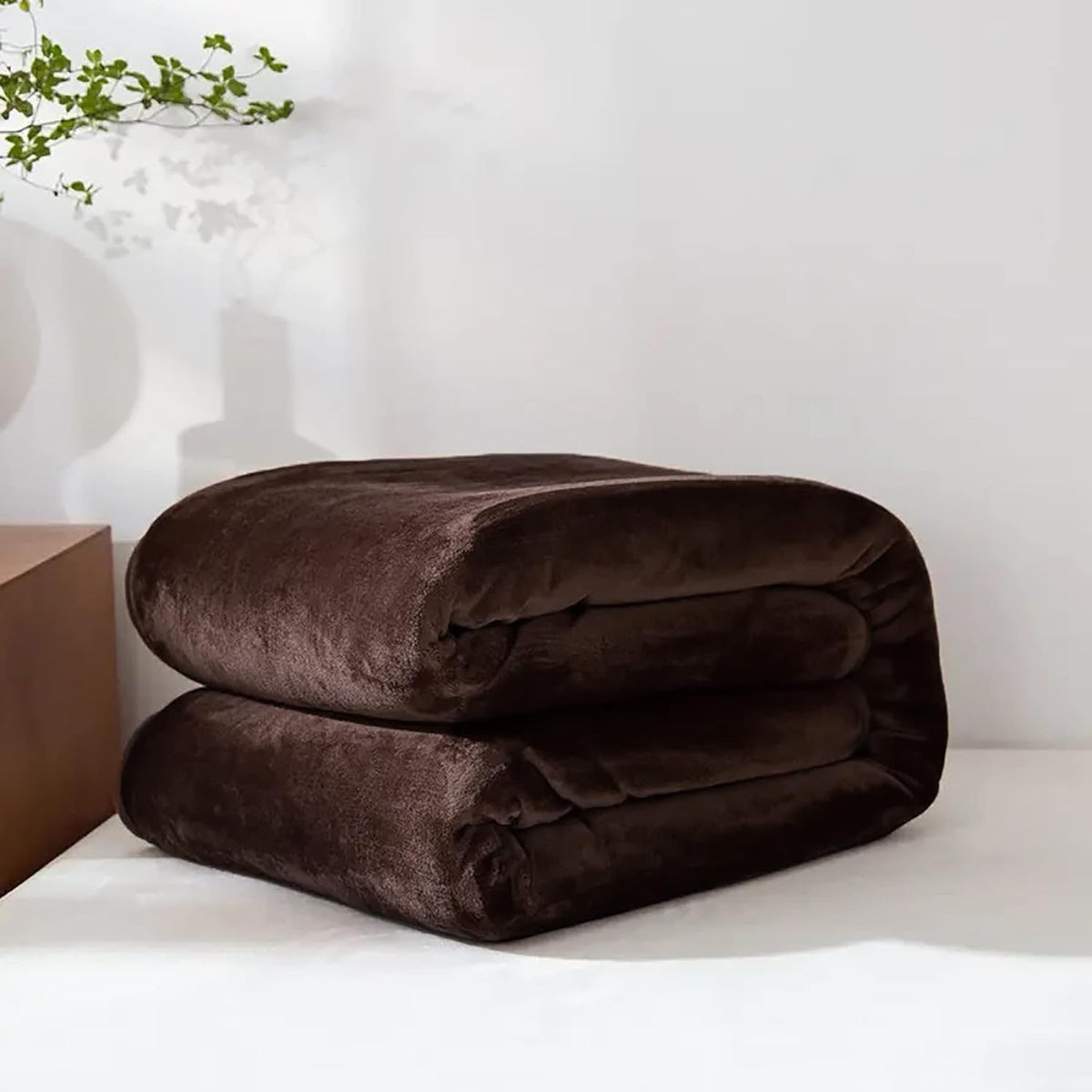 Coffee brown fleece throw folded on a table