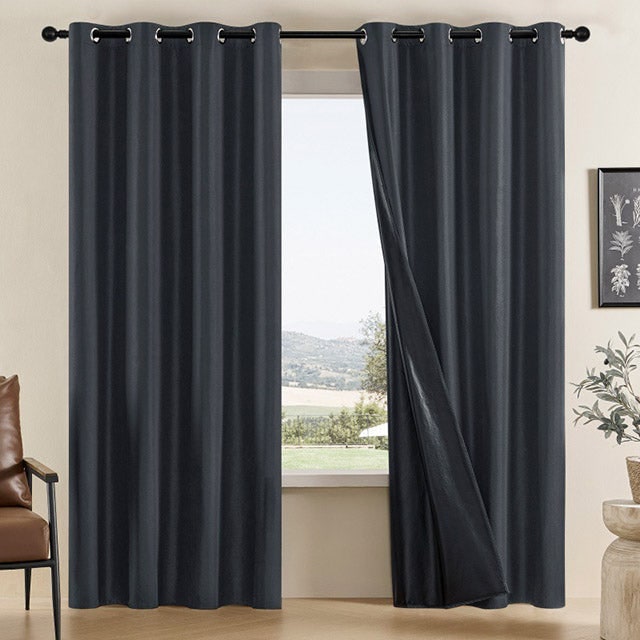 Black eyelet curtain panels with dark lining
