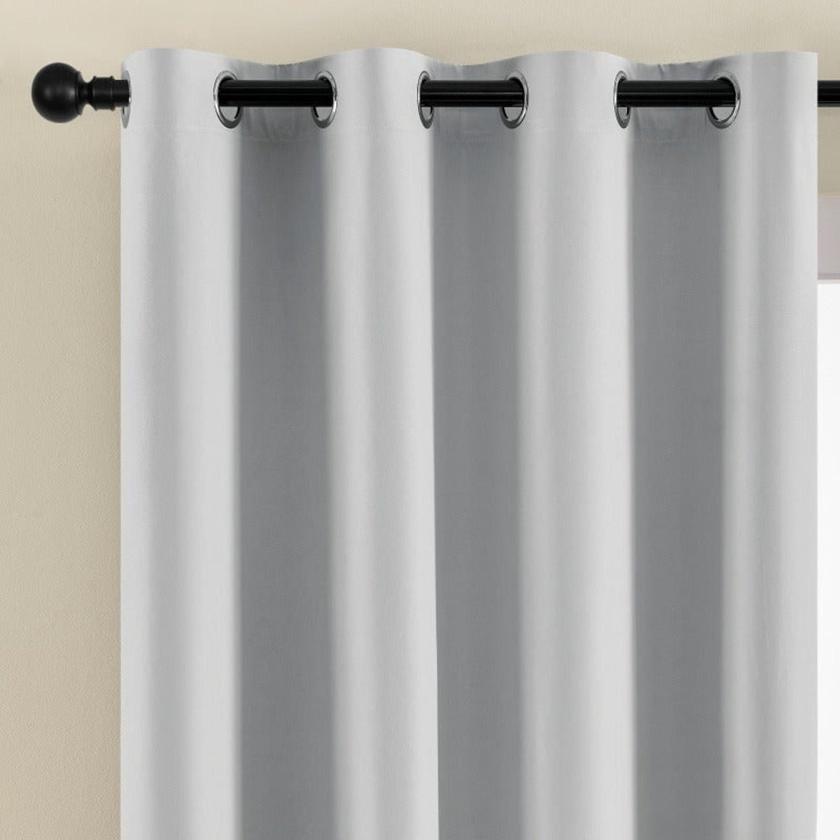 Light-coloured eyelet curtain fabric close-up
