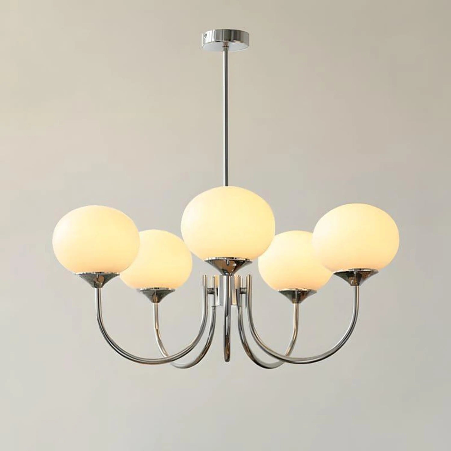 Modern glass ball pendant light with metal finish, suitable for living room or bedroom ceiling lighting.
