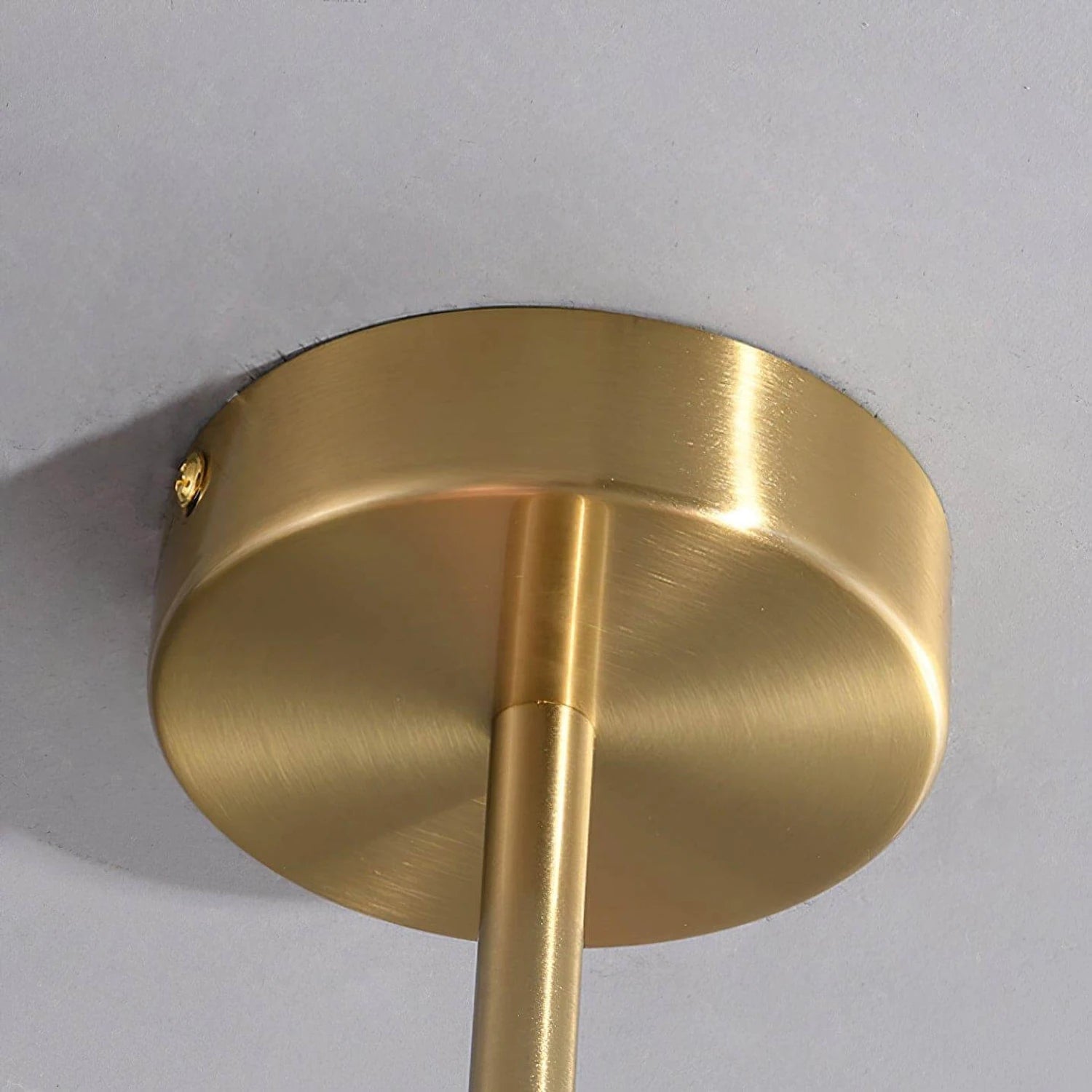 Modern glass ball pendant light with metal finish, suitable for living room or bedroom ceiling lighting.
