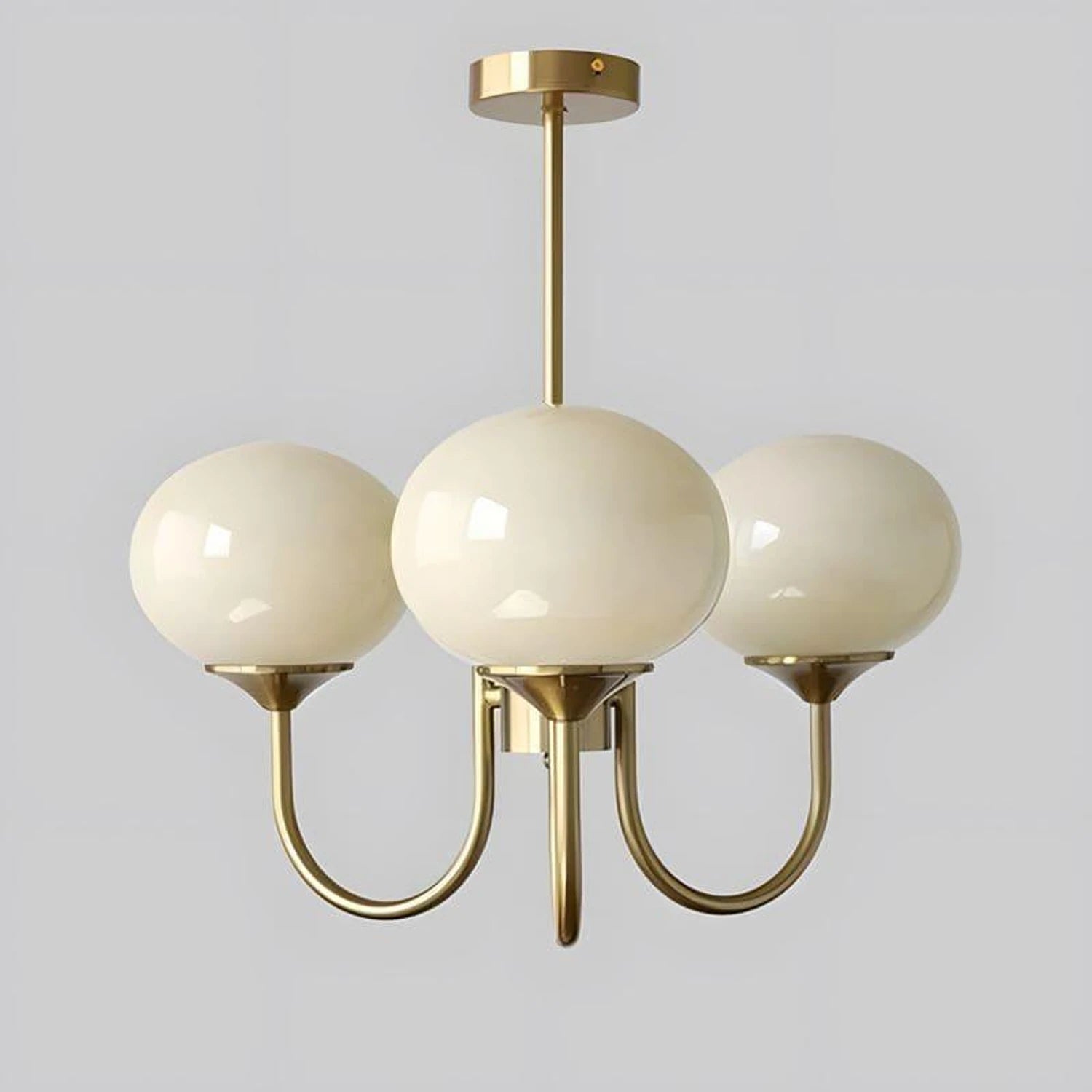 Modern glass ball pendant light with metal finish, suitable for living room or bedroom ceiling lighting.