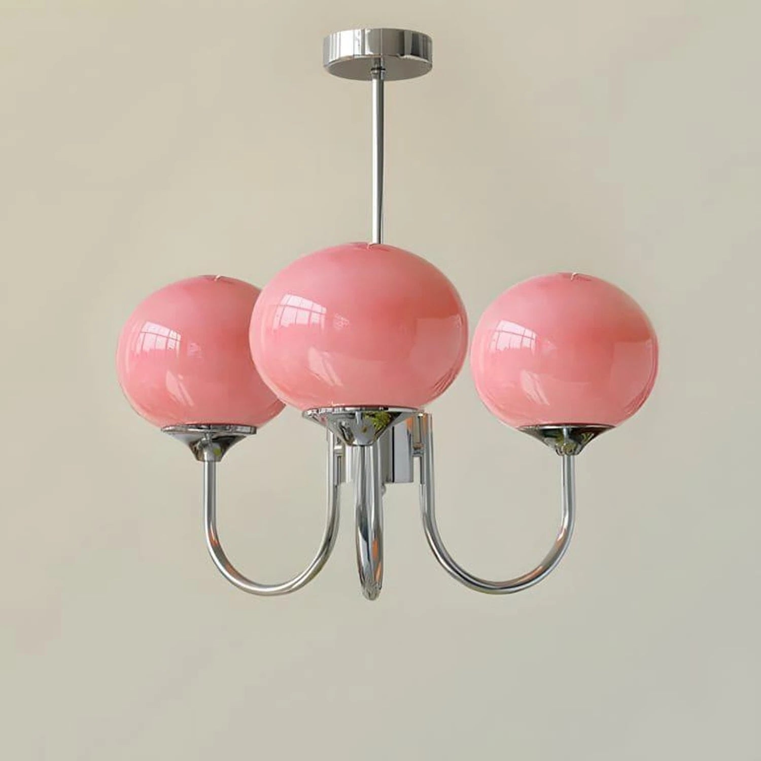 Modern glass ball pendant light with metal finish, suitable for living room or bedroom ceiling lighting.