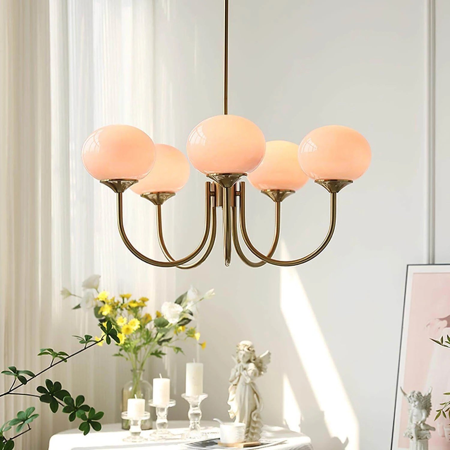 Modern glass ball pendant light with metal finish, suitable for living room or bedroom ceiling lighting.