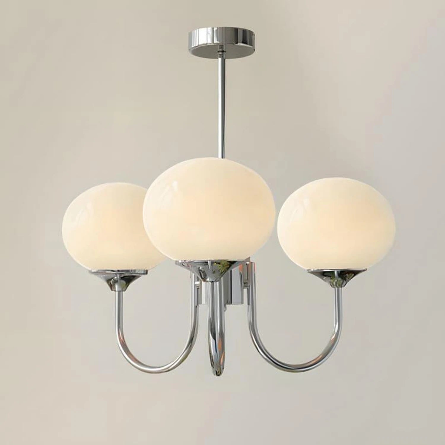 Modern glass ball pendant light with metal finish, suitable for living room or bedroom ceiling lighting.