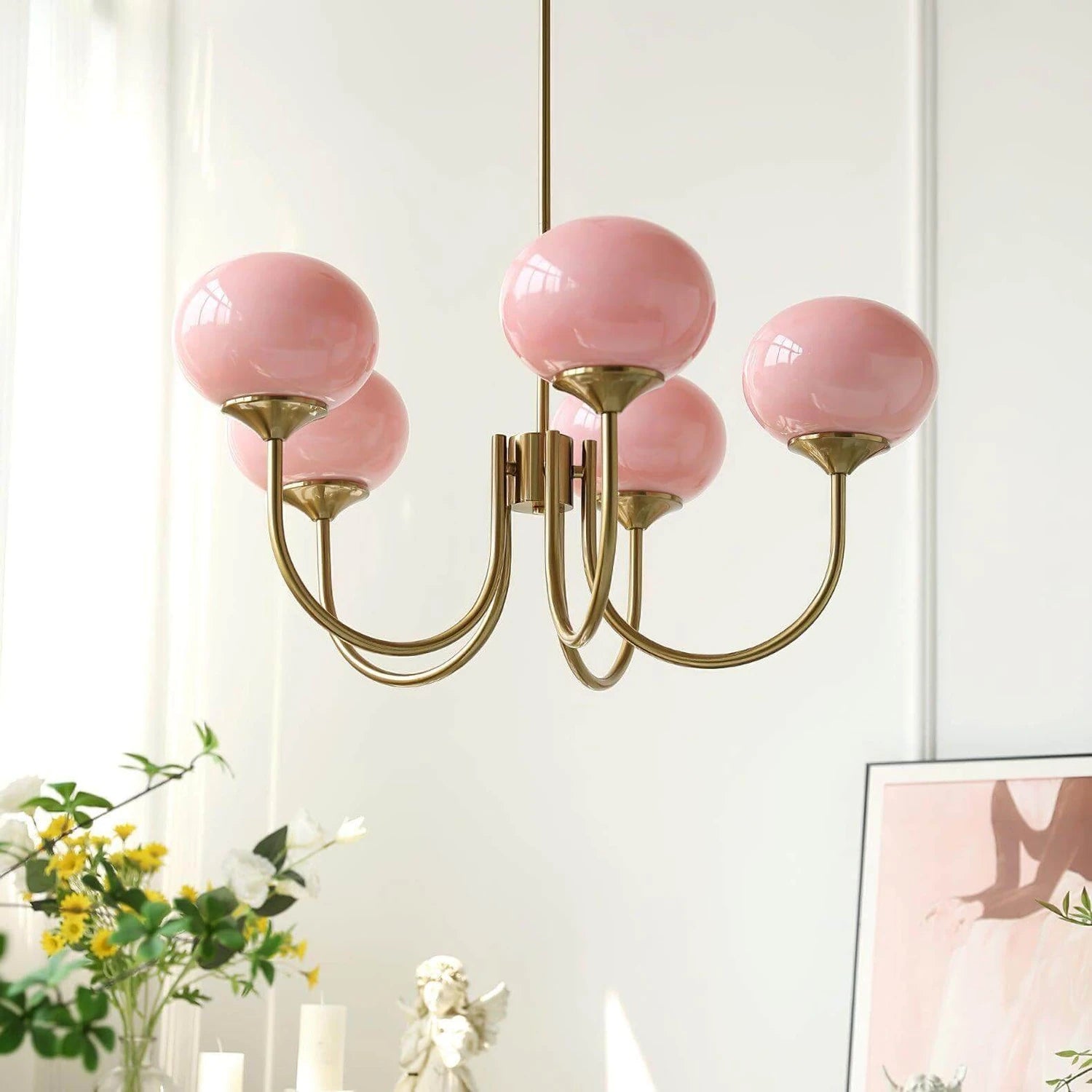 Modern glass ball pendant light with metal finish, suitable for contemporary dining rooms and bedrooms.