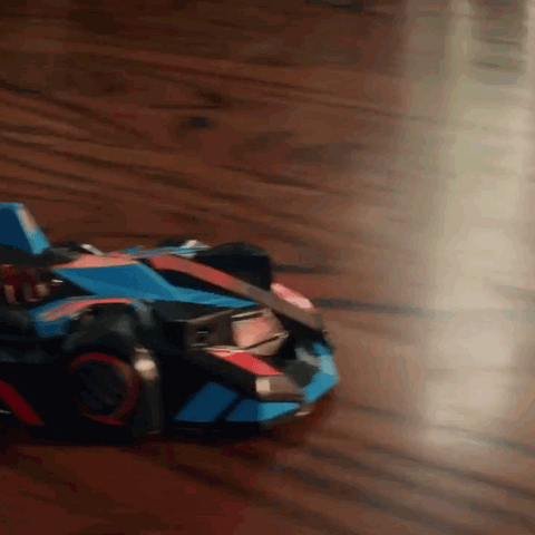 Wall-climbing car driving along a raised surface