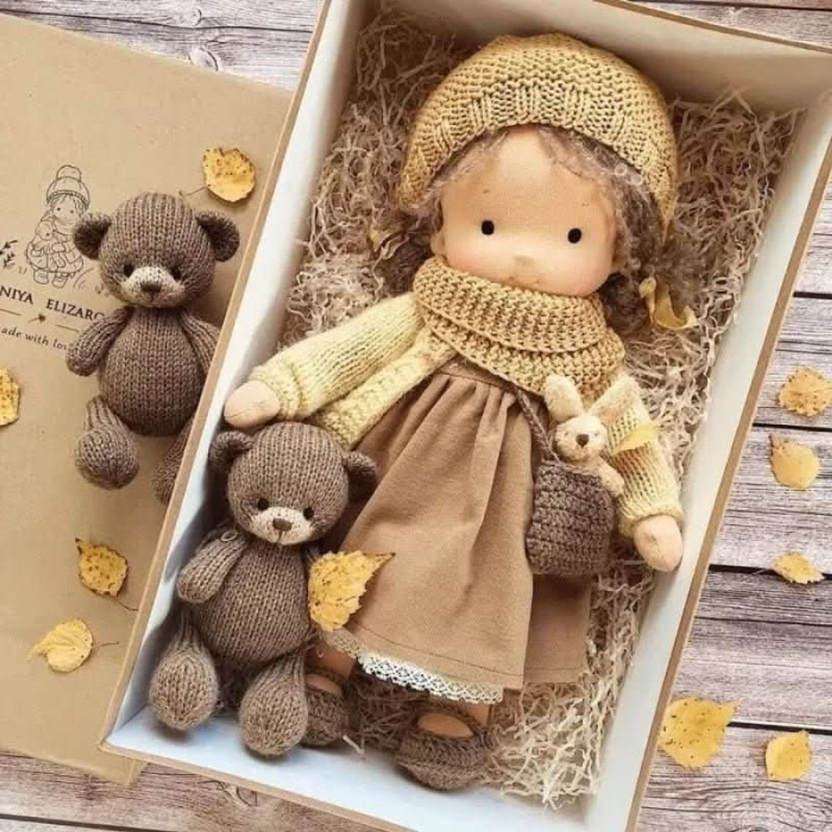 Blonde cloth doll in yellow hat and scarf