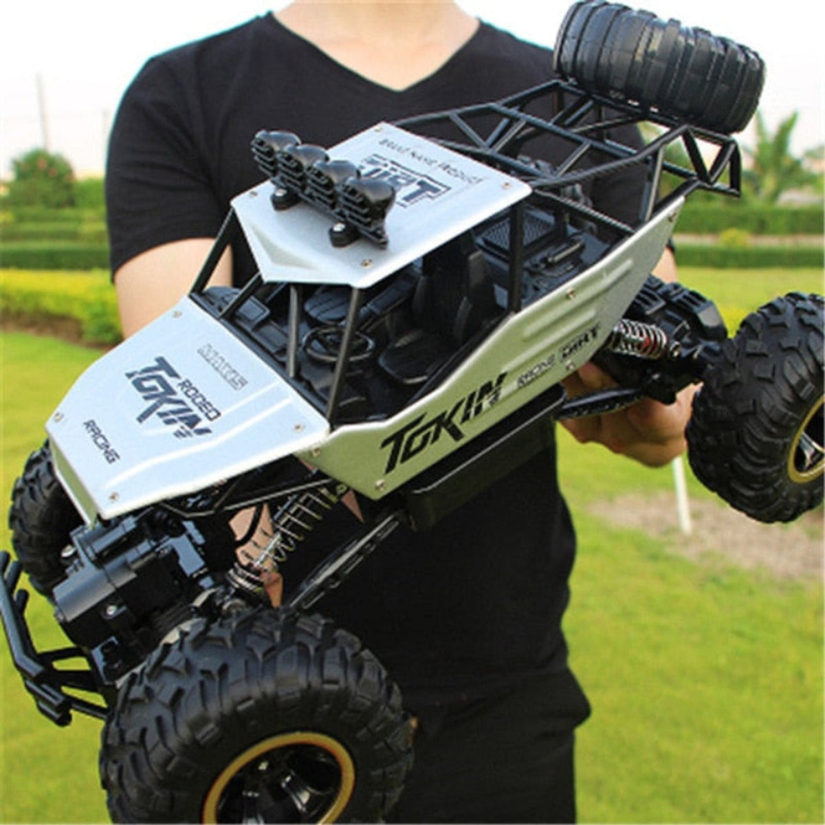 Silver-panel off-road RC car with treaded tyres
