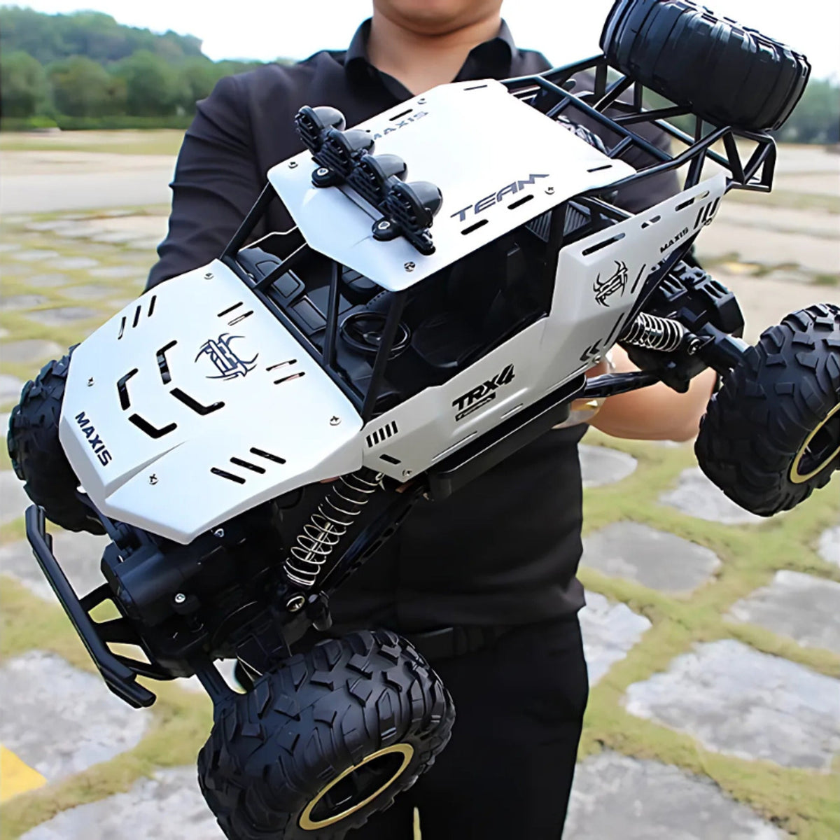 White off-road RC car with raised chassis