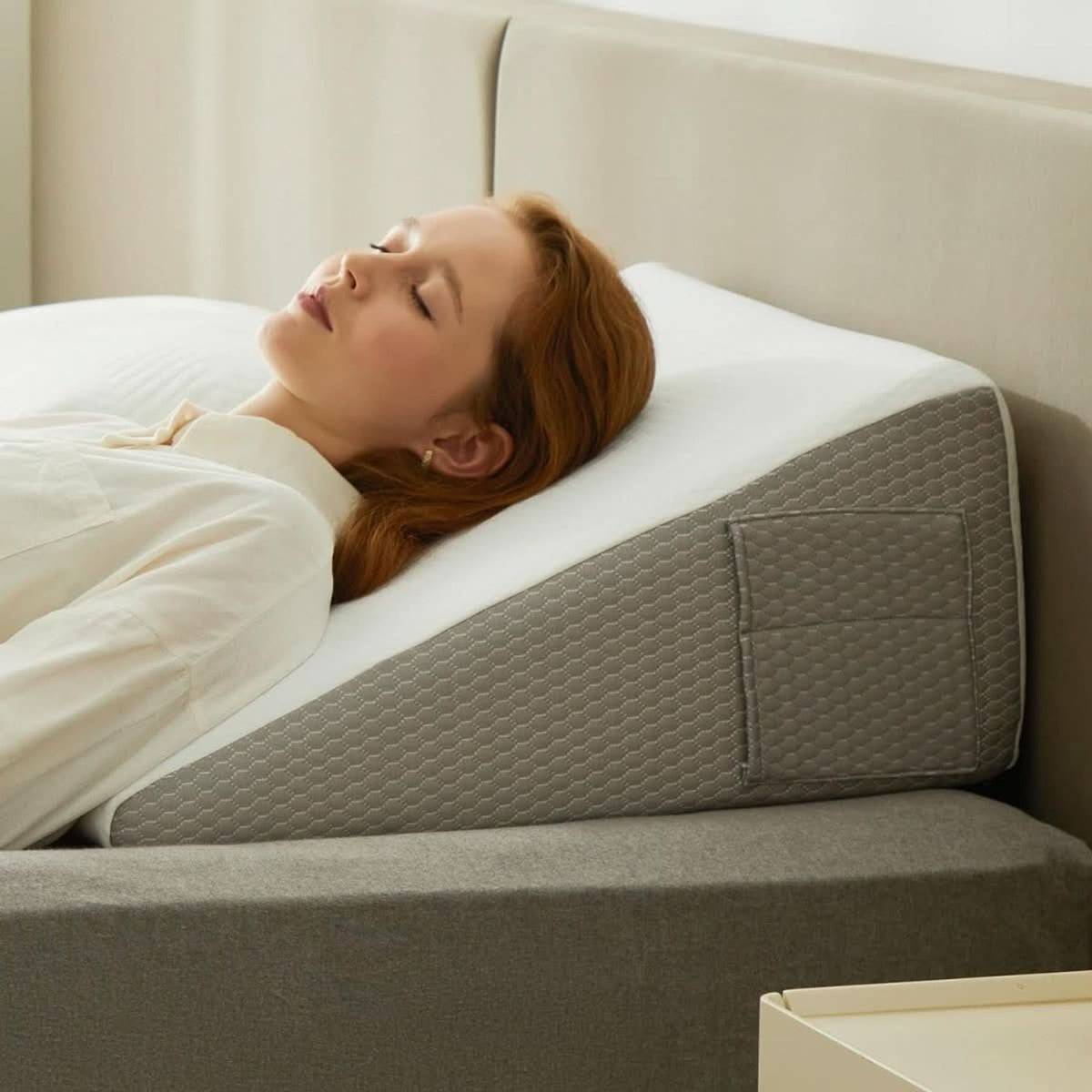 Memory foam wedge pillow with grey sides and white cover