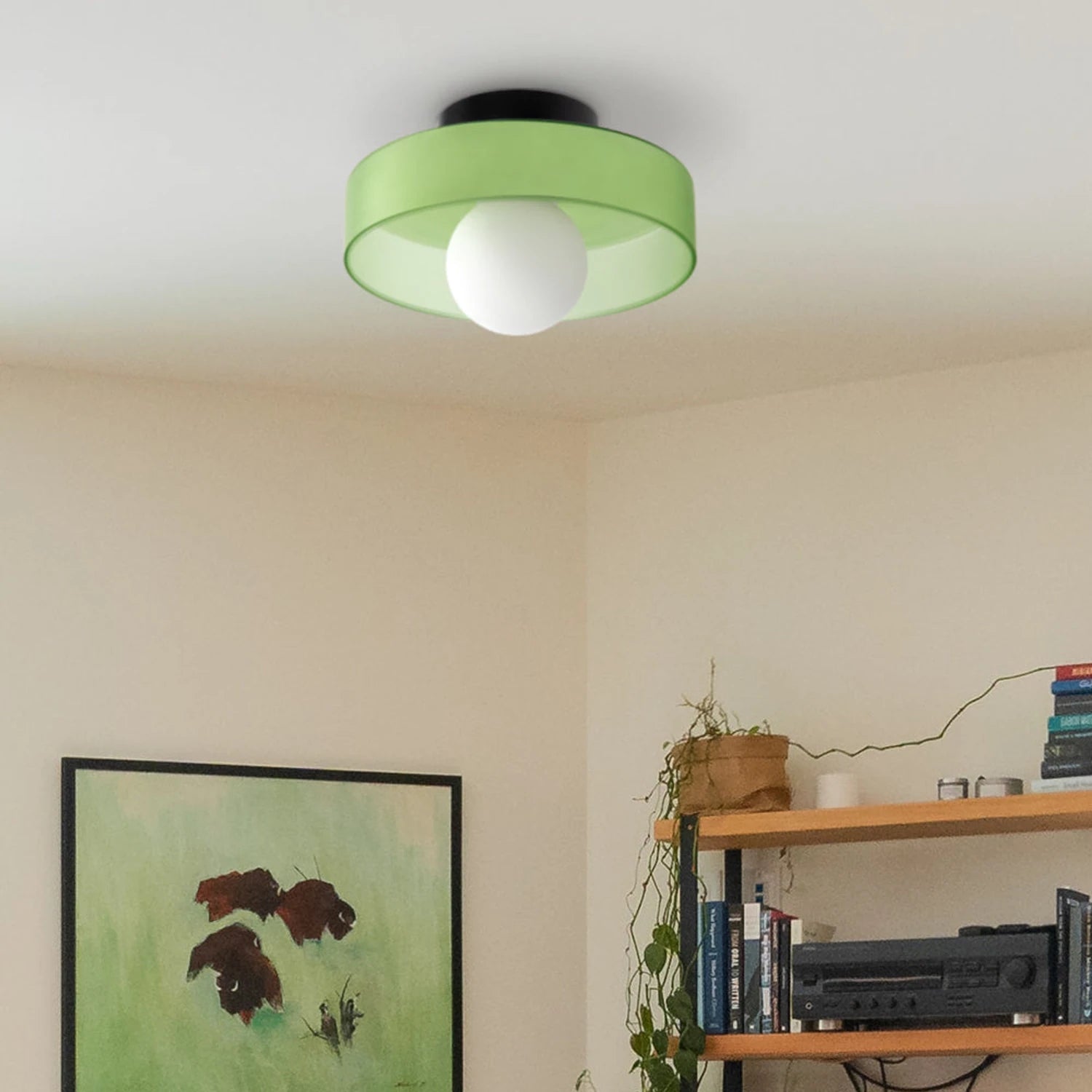 Minimalist modern flush mount ceiling light in olive green with a low-profile design for soft, glare-free illumination in bedrooms and hallways.