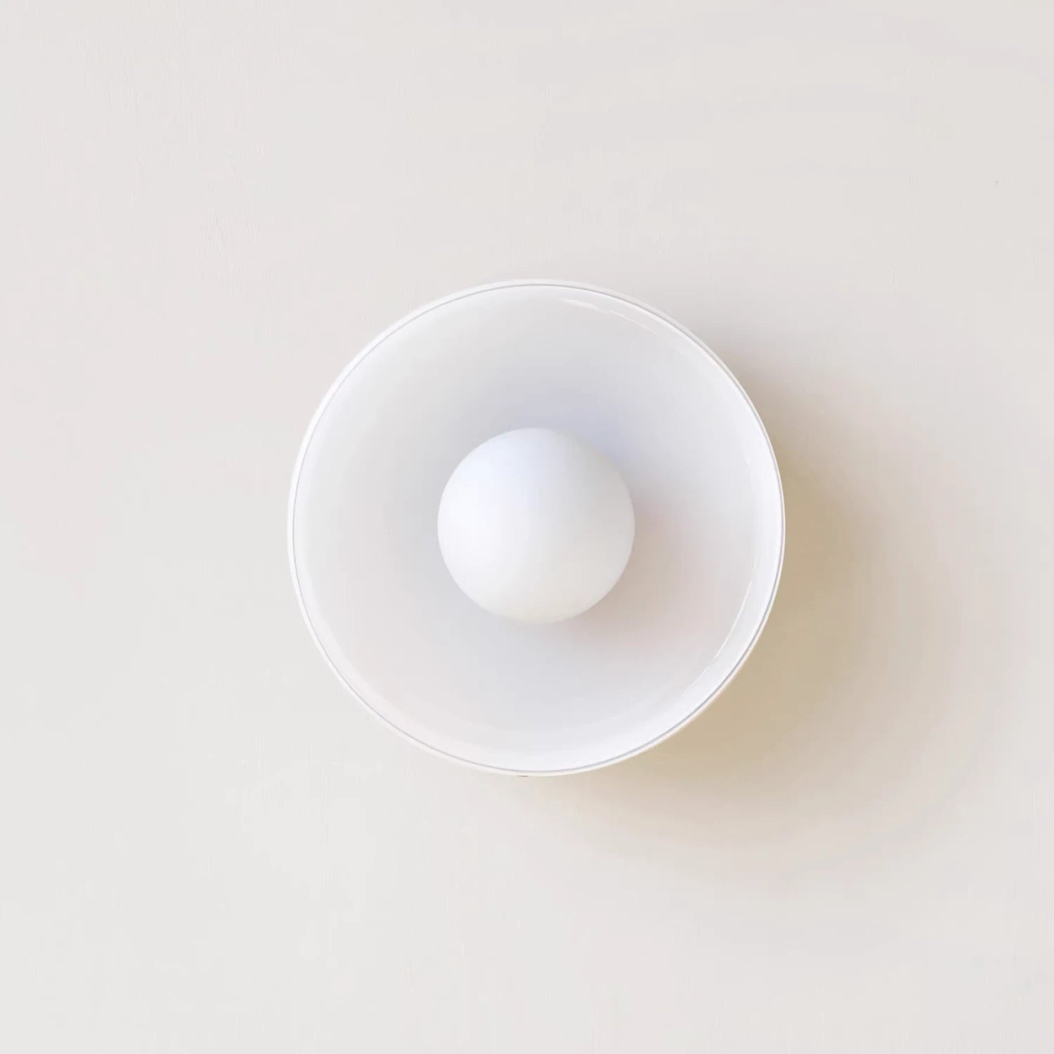 Minimalist modern flush mount ceiling light in olive green with a low-profile design for soft, glare-free illumination in bedrooms and hallways.