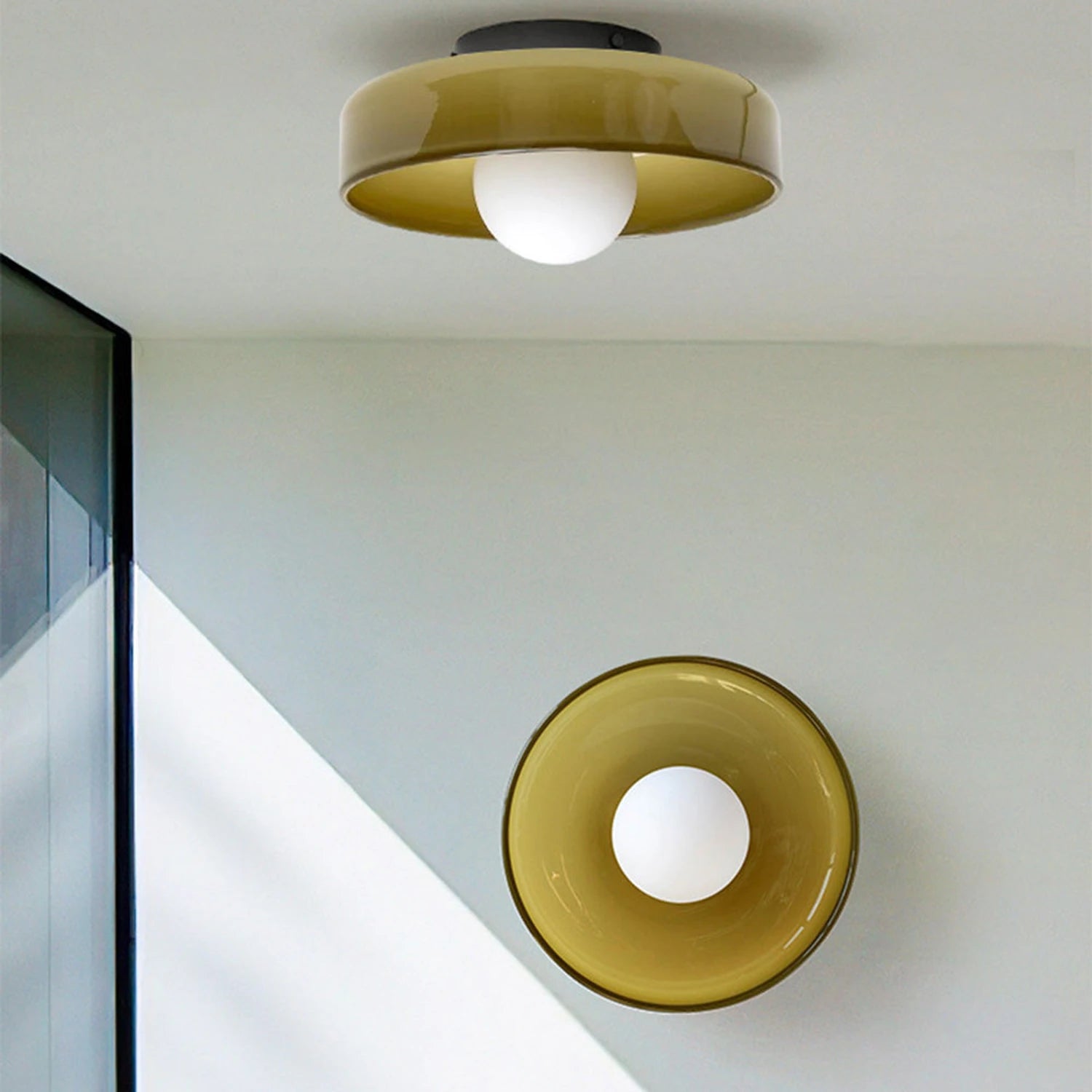 Minimalist modern flush mount ceiling light in olive green with a low-profile design for soft, glare-free home illumination.