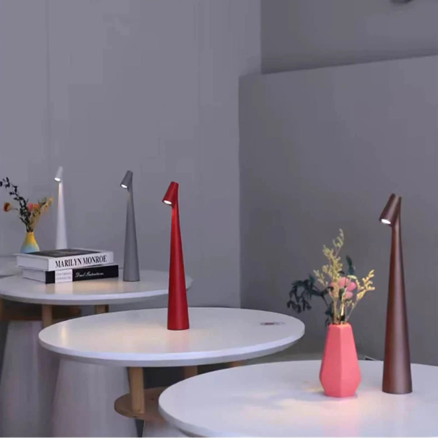 Nordic minimalist cordless aluminium LED table lamp with touch-dimmable light in various colours for modern bedroom and living room decor.