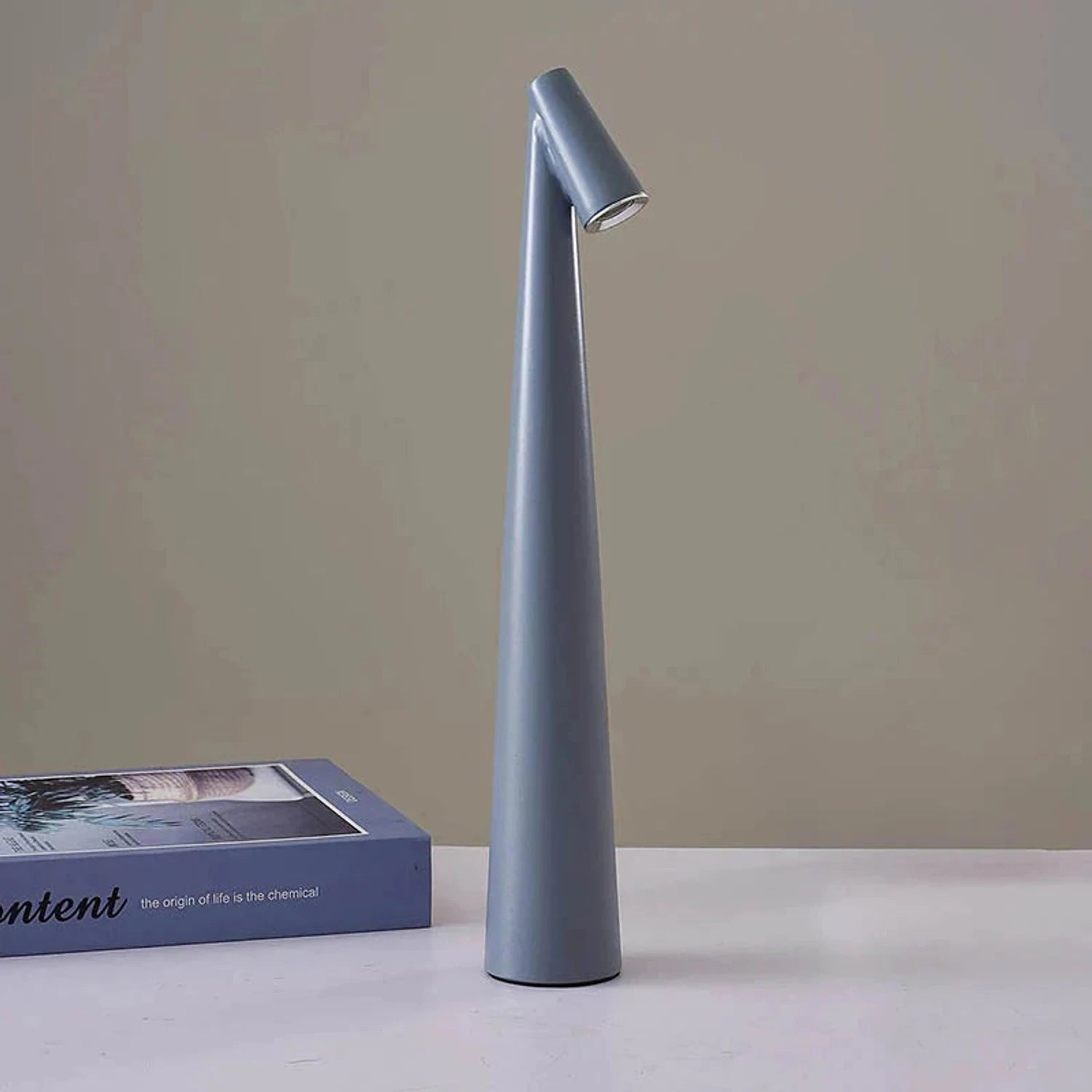 Minimalist Nordic cordless aluminium LED table lamp with touch-dimmable light in various colours for bedroom or living room decor.