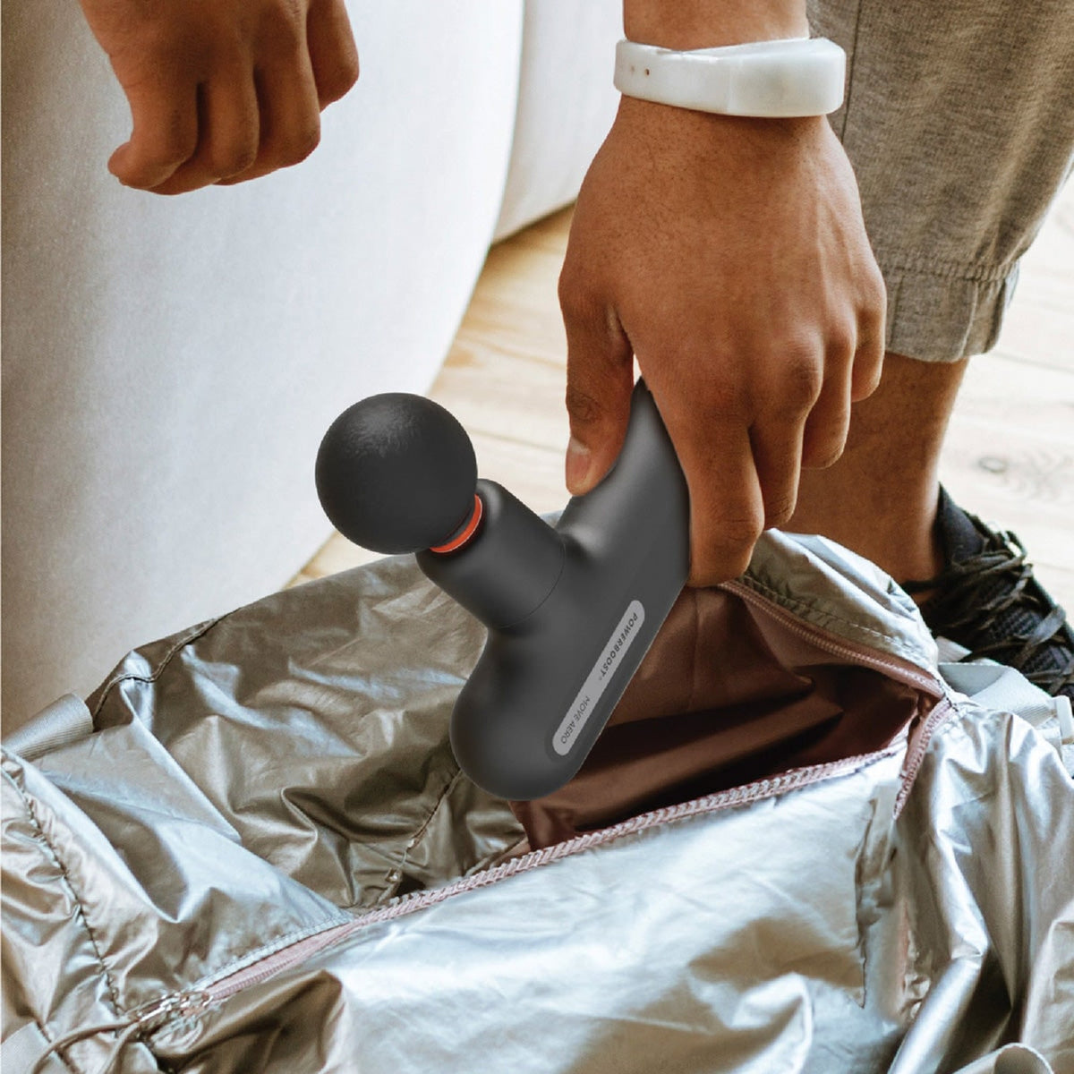 Portable Move Aero massager beside a travel bag