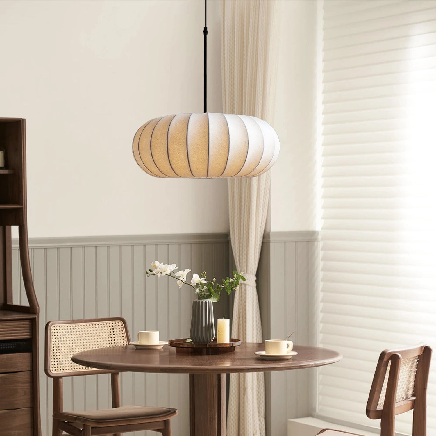 Handcrafted silk pumpkin pendant light with a retro Wabi-Sabi design and dimmable LED, perfect for elegant home lighting.