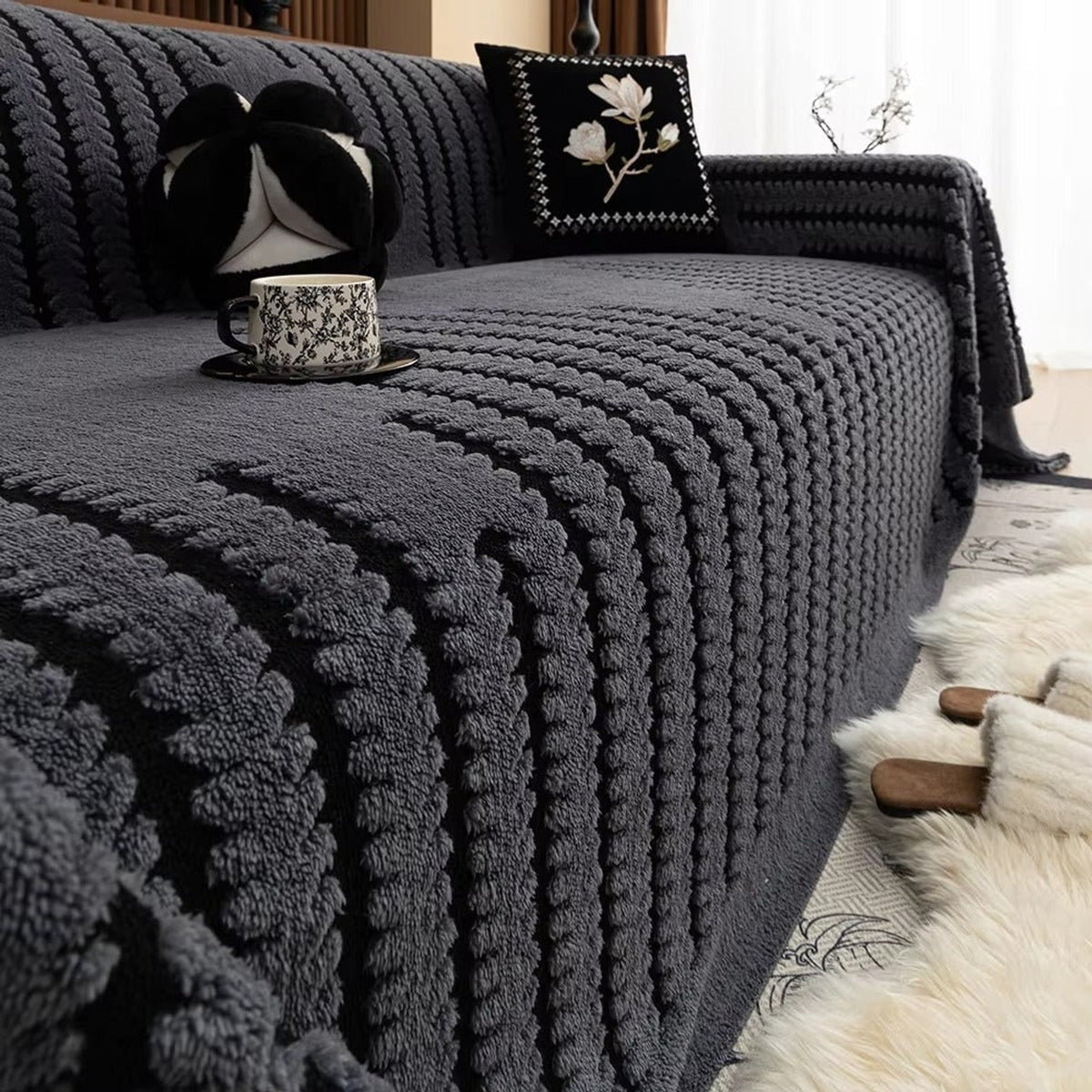 Charcoal tufted sofa blanket with black stripes