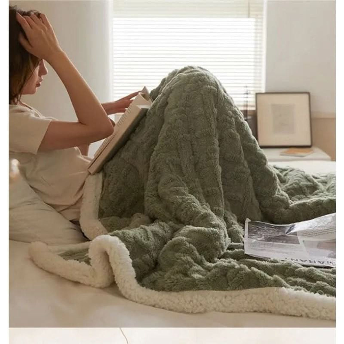 Green textured blanket with light reverse