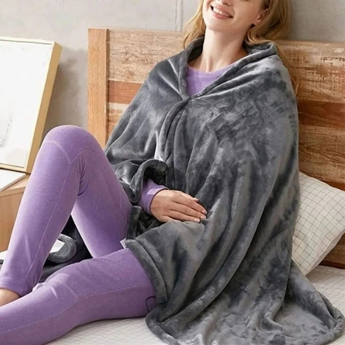 Grey heated fleece blanket fastened around the shoulders